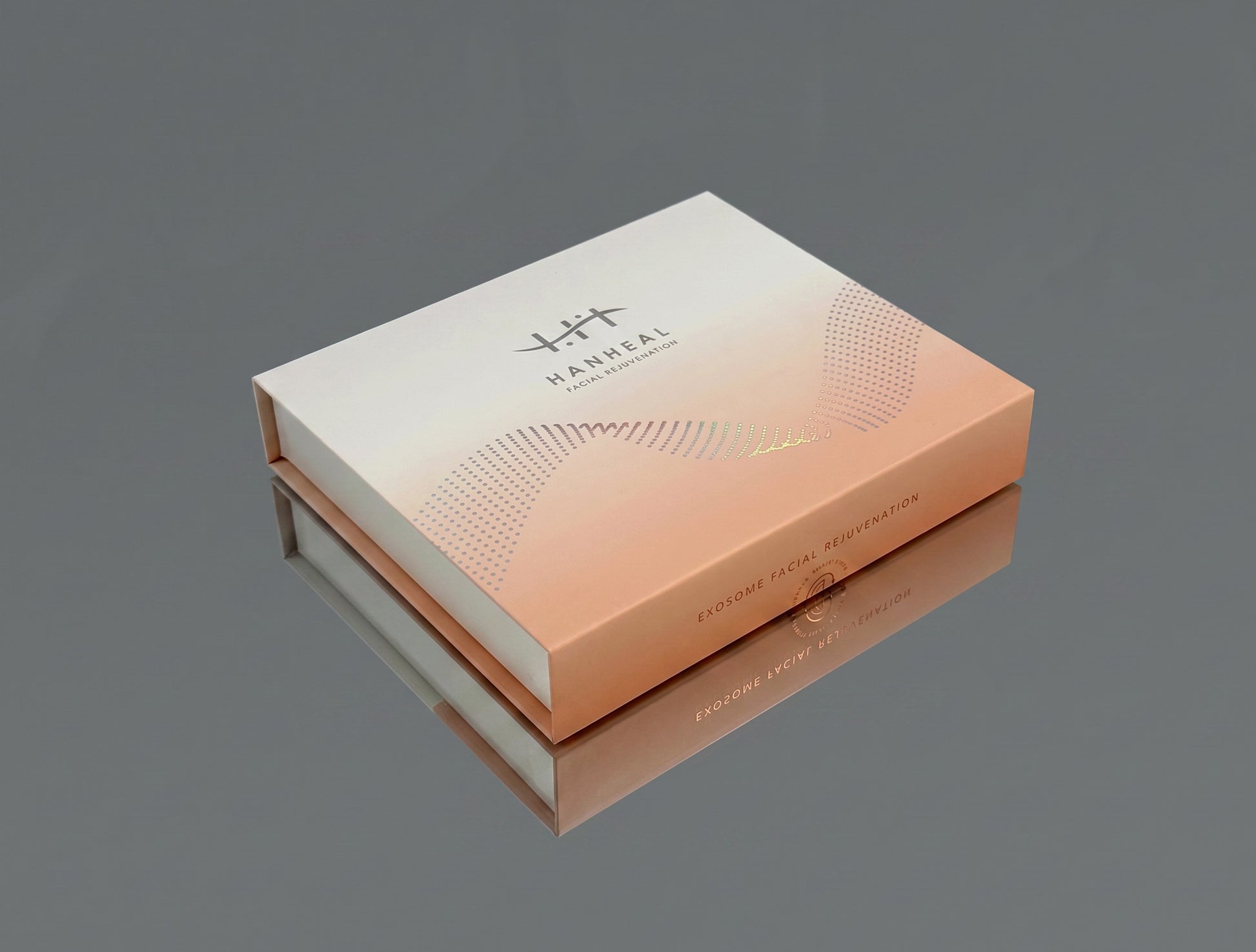 DIY Skincare Lab™ HANHEAL Exosome Facial Rejuvenation box in a gradient peach and white design on a reflective surface.