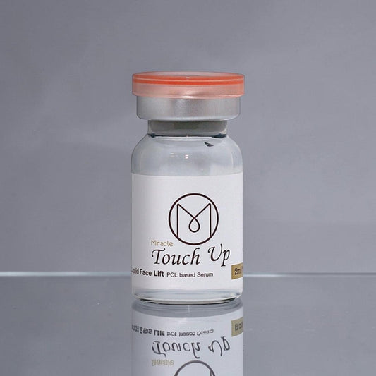 DIY Skincare Lab™ Miracle Touch Up PCL-based radiance ampoule in a clear 2ml glass vial with an orange cap.