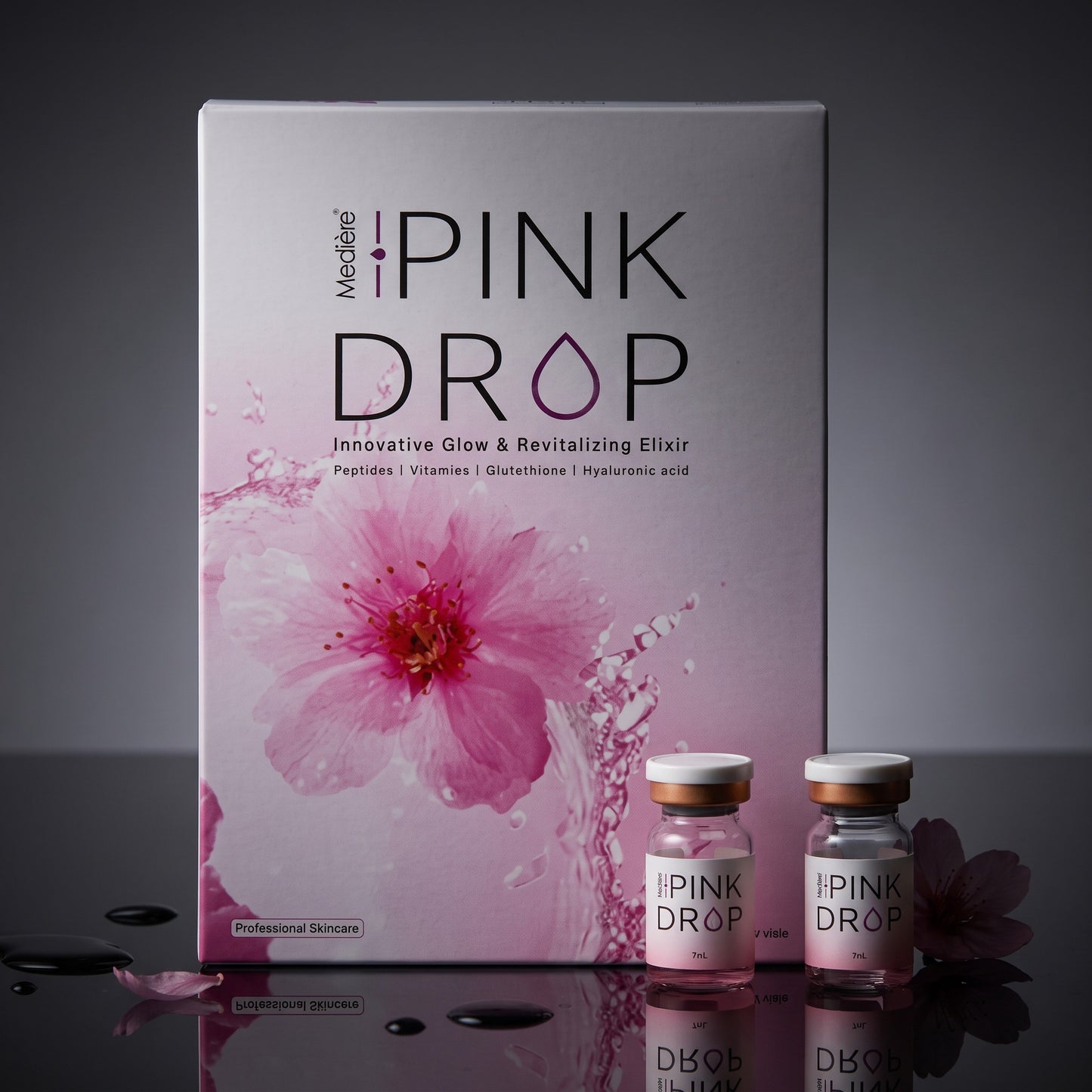 DIY Skincare Lab™ Pink Drop radiant skin booster set featuring a box and two glass vials with pink serum and floral art.