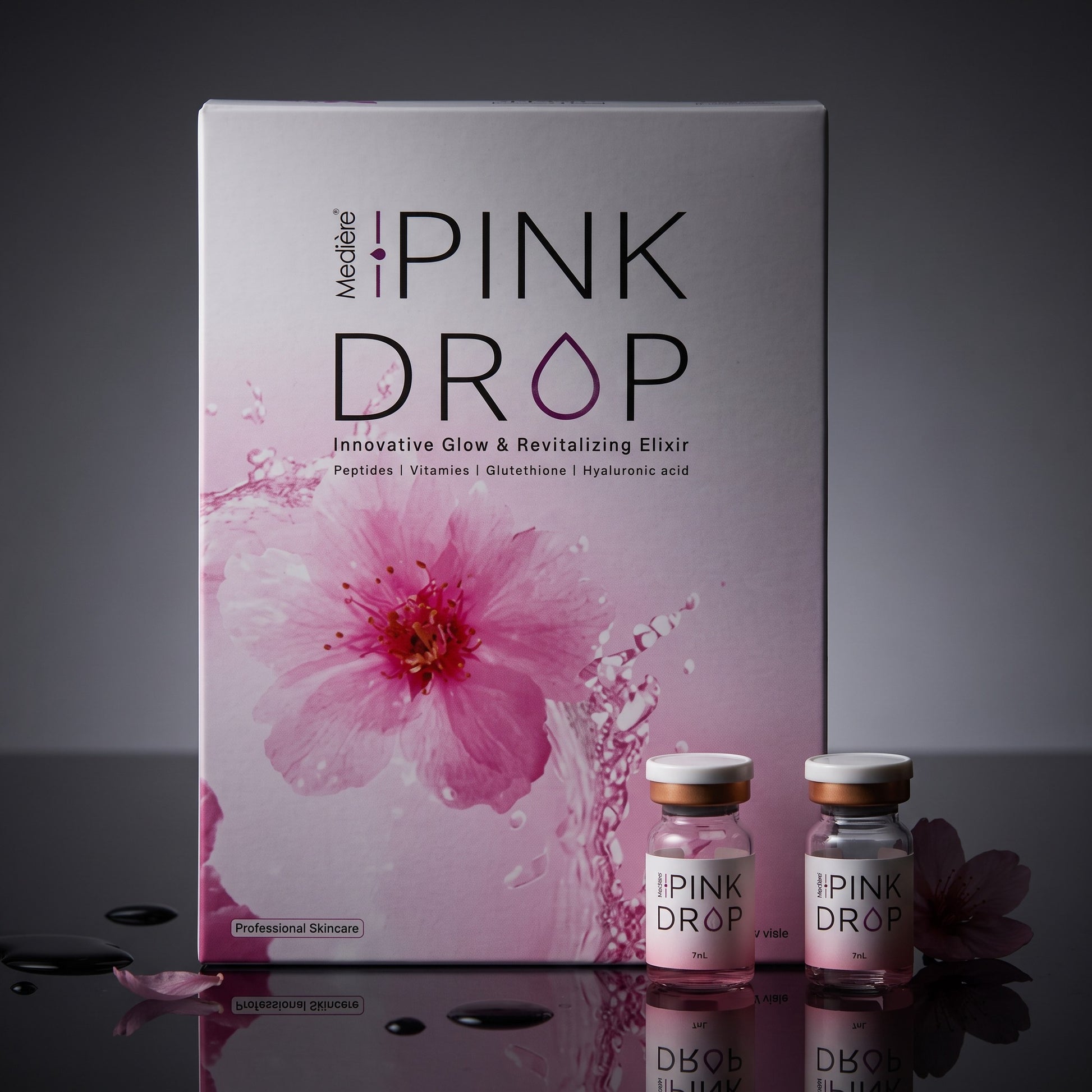 DIY Skincare Lab™ Pink Drop radiant skin booster set featuring a box and two glass vials with pink serum and floral art.