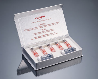 DIY Skincare Lab™ Velatox GF11 skin revitalizing kit featuring five pink ampoules and two blue serum vials in a box.